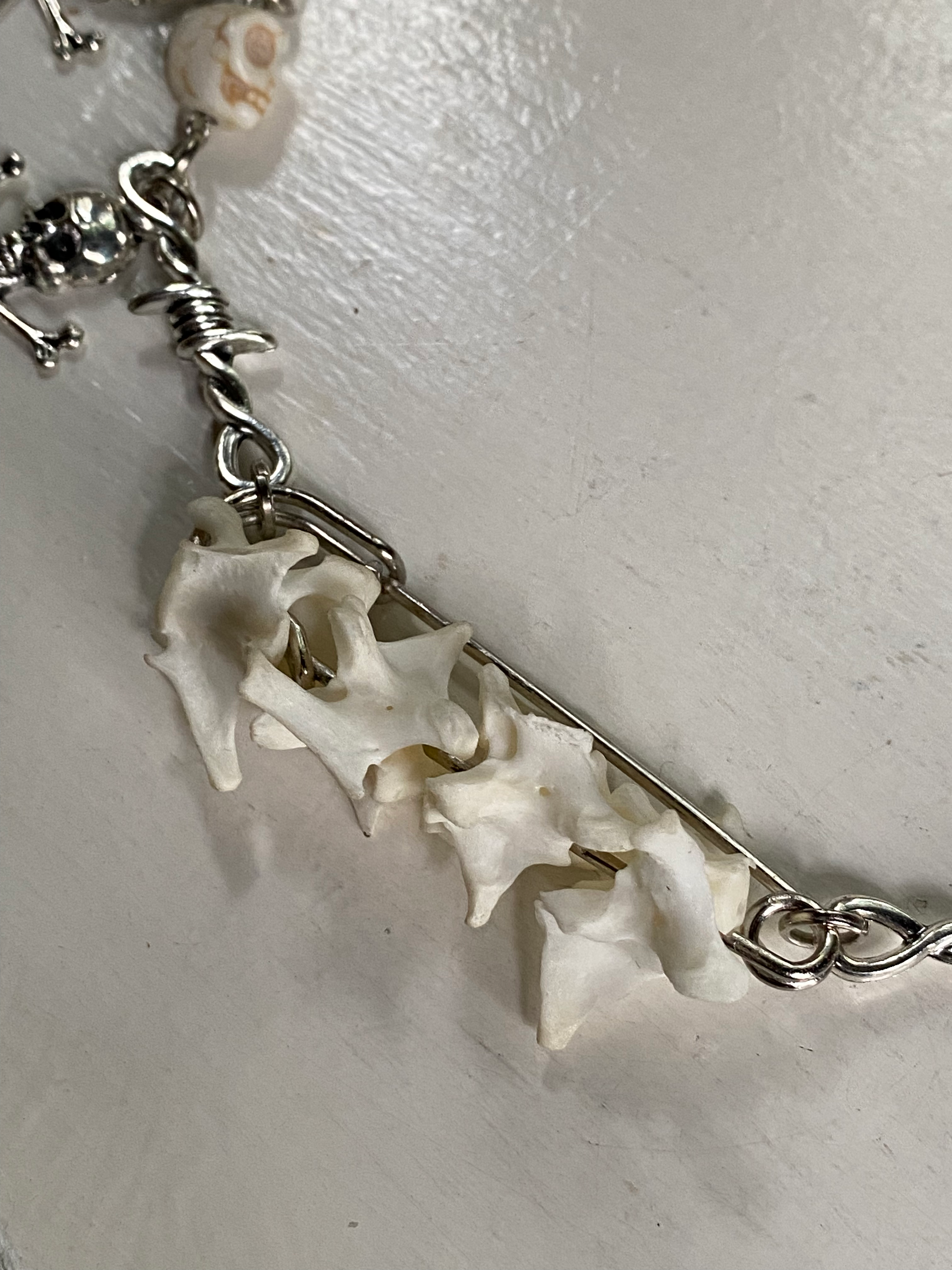 Mink Vertibrae on Safety Pin and Skulls Necklace image 2
