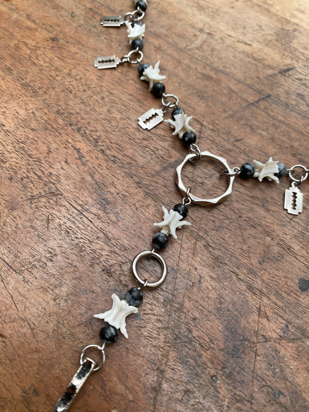 Inverted Crucifix, Snake Vertibrae and Obsidian Rosary Necklace