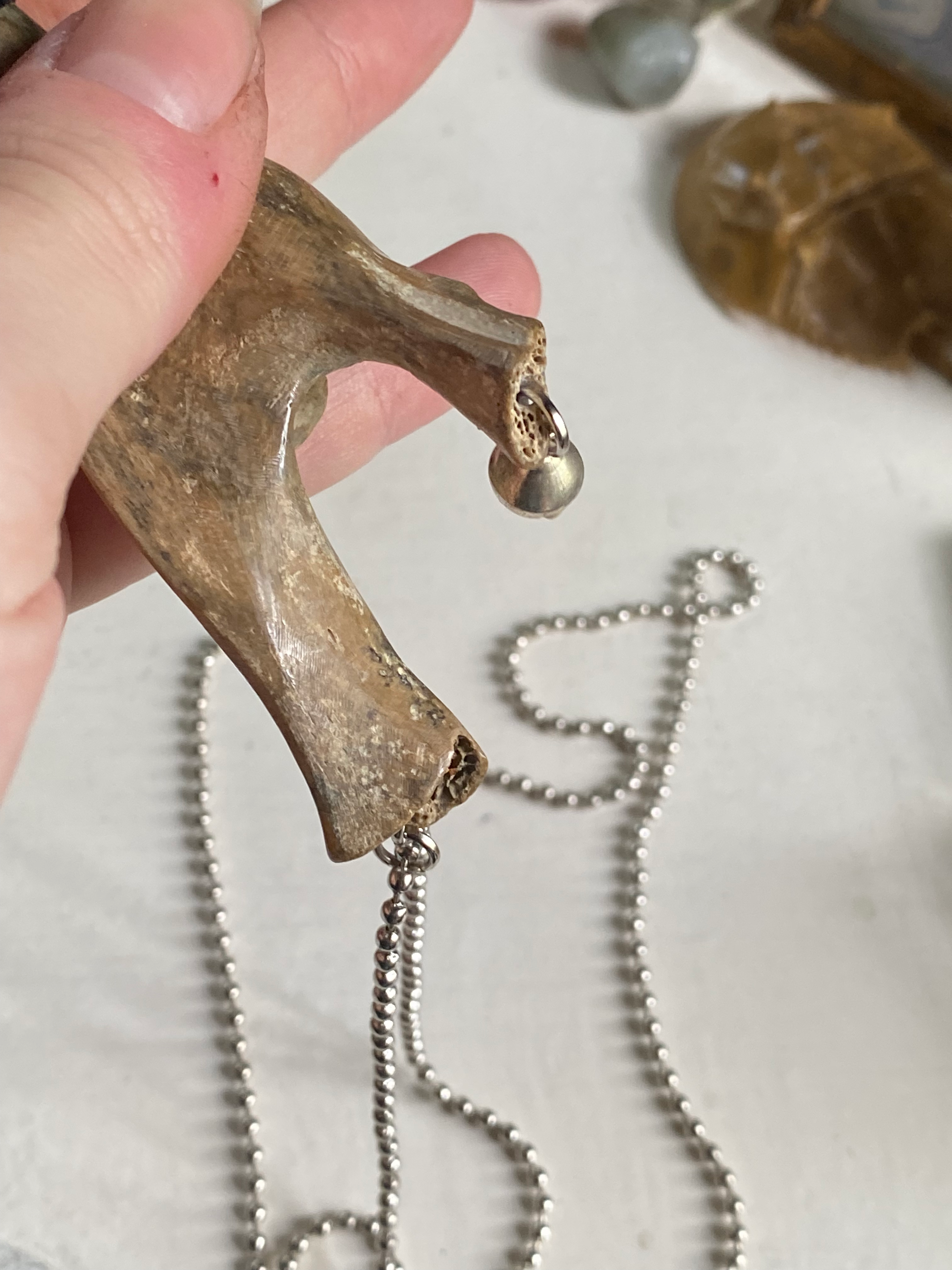 Fossilised Bone Knife with Chain, Bell and Clear Bead  image 3