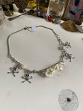 Mink Vertibrae on Safety Pin and Skulls Necklace image 0