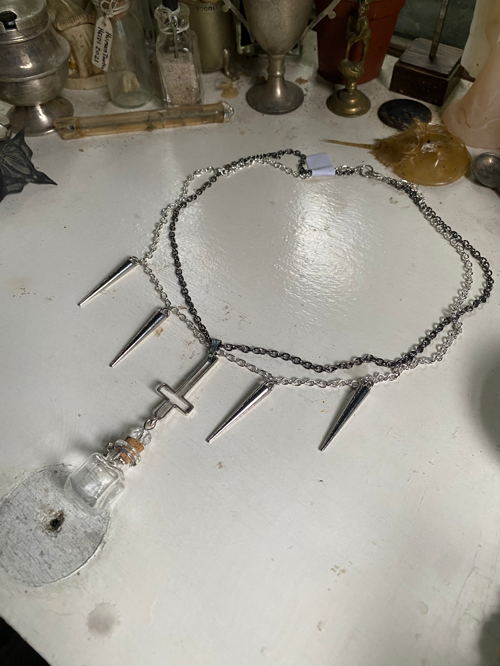 Glass Vial and Inverted Cross Necklace image 0