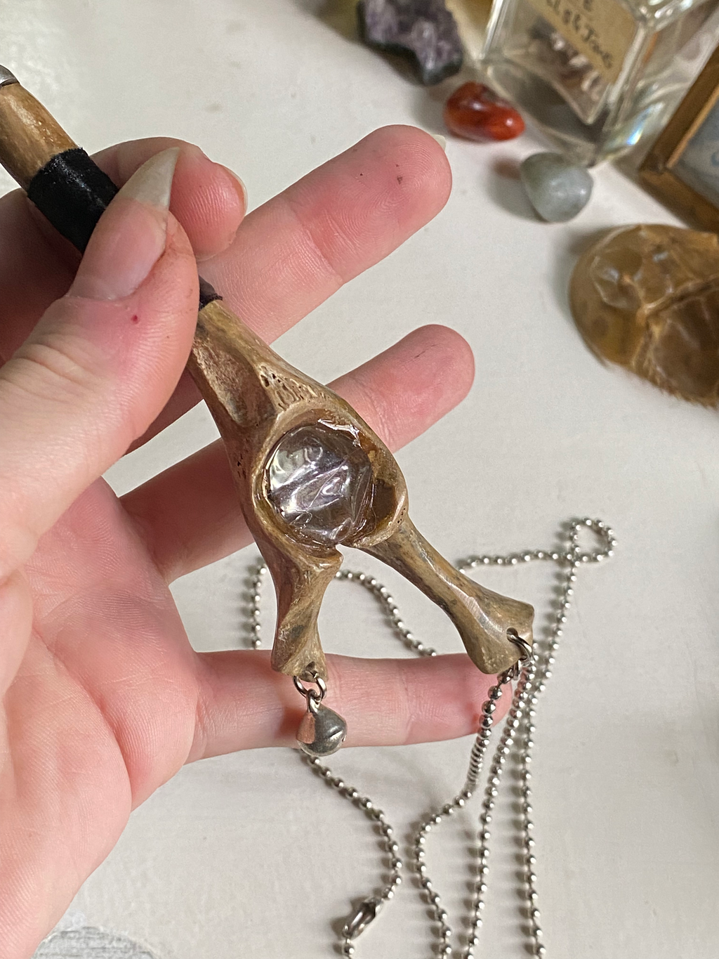 Fossilised Bone Knife with Chain, Bell and Clear Bead  image 2