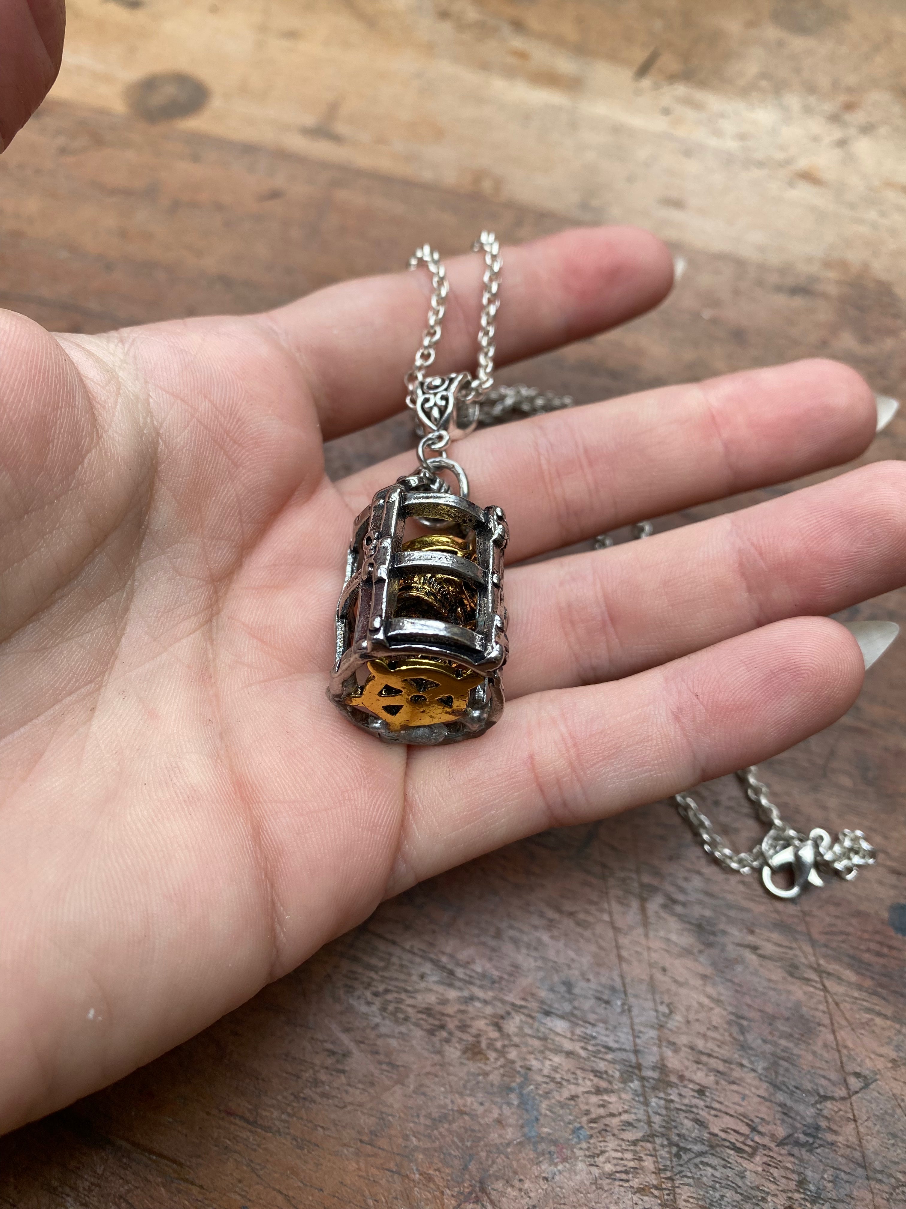 Gold Skull in Silver Cage Pendant Necklace