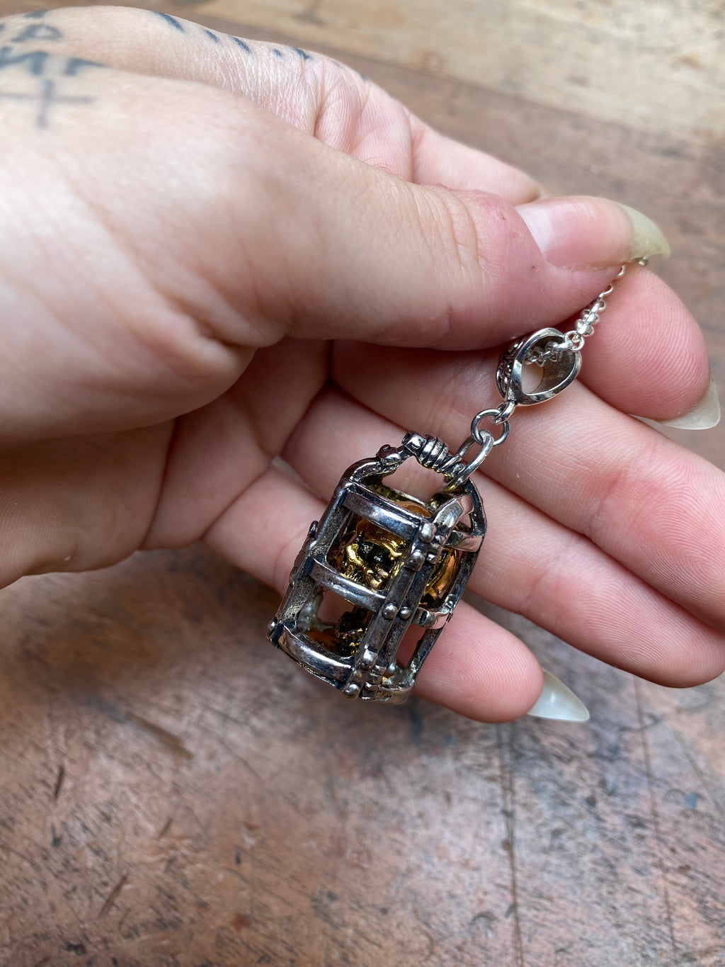 Gold Skull in Silver Cage Pendant Necklace
