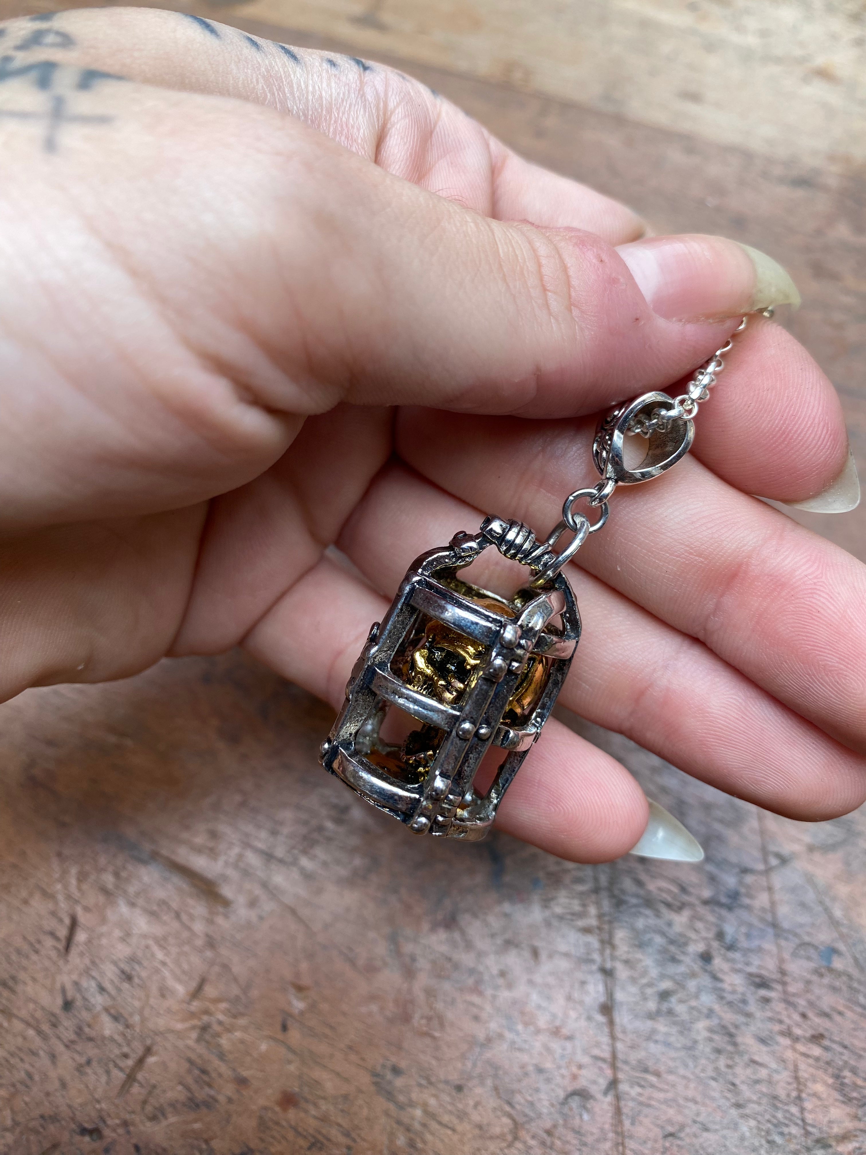 Gold Skull in Silver Cage Pendant Necklace