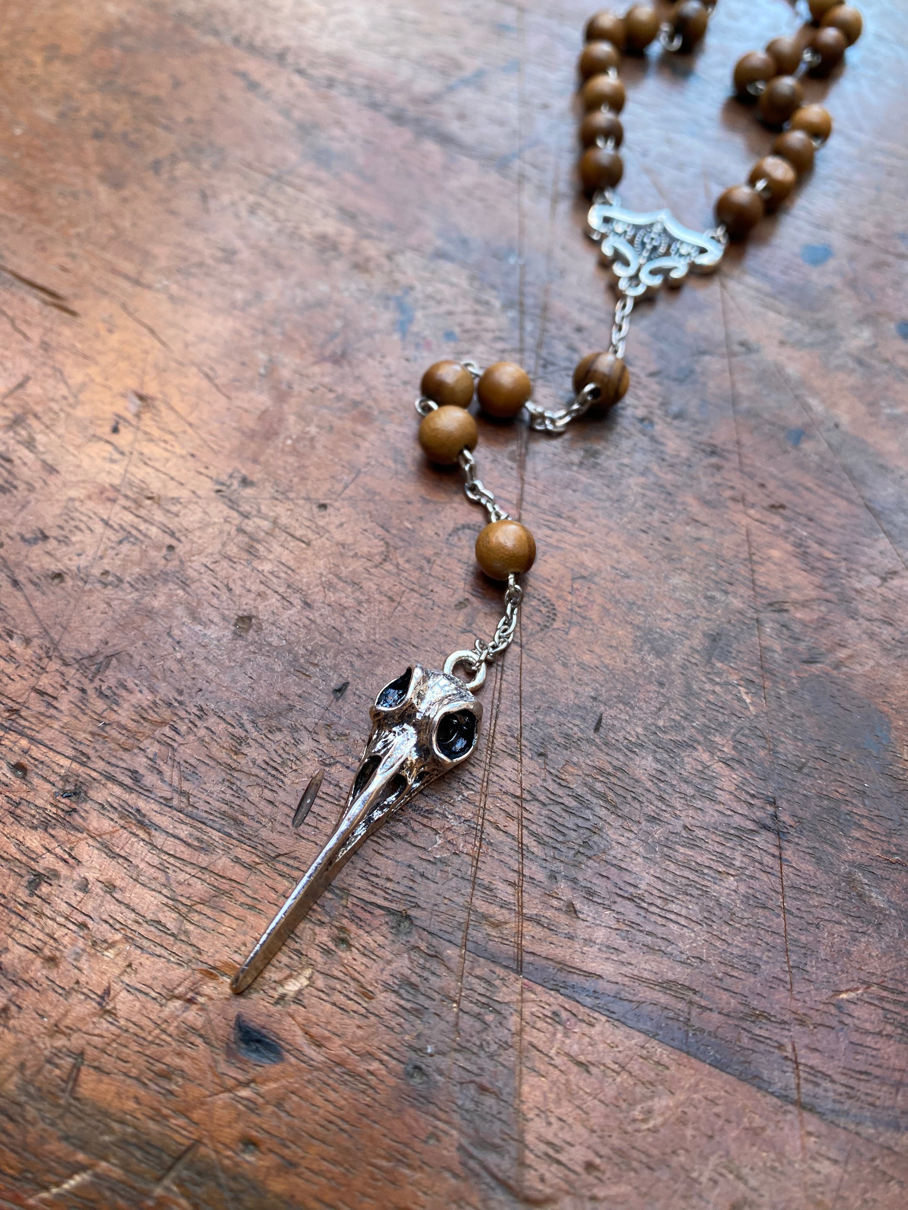 Wooden Bead Rosary with Bird Skull