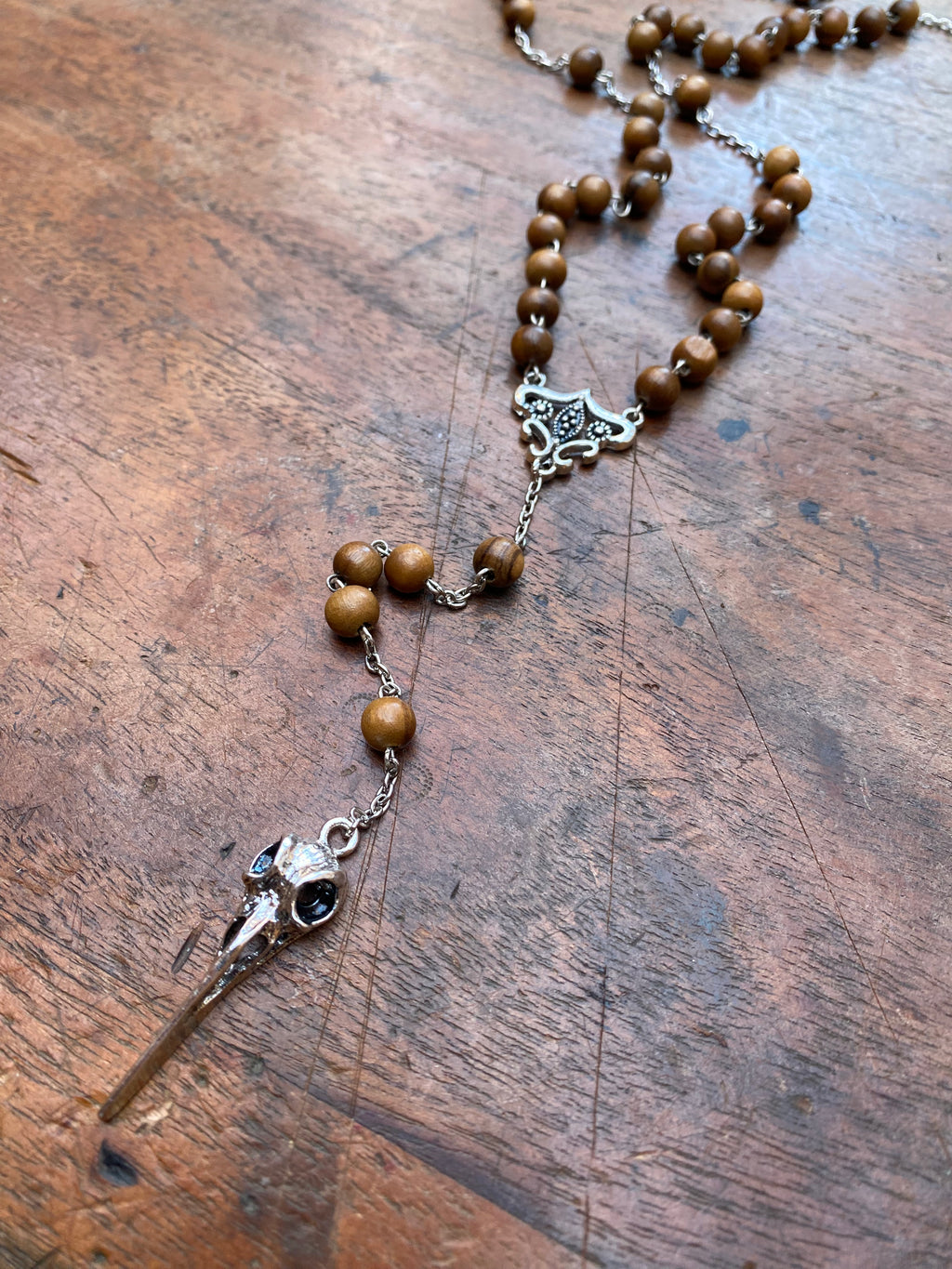 Wooden Bead Rosary with Bird Skull