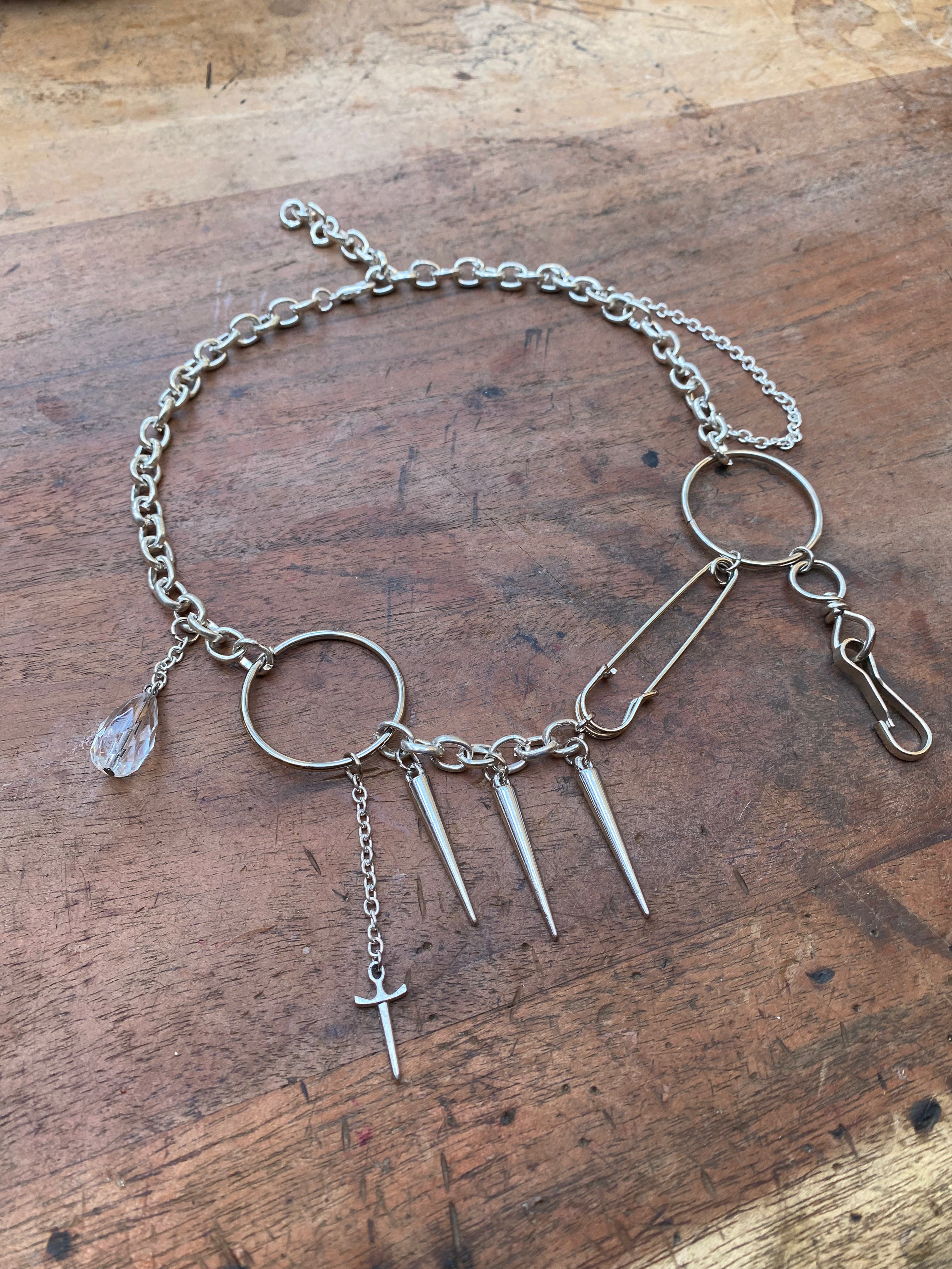 Asymmetrical Safety Pin, Spikes and Rings Necklace