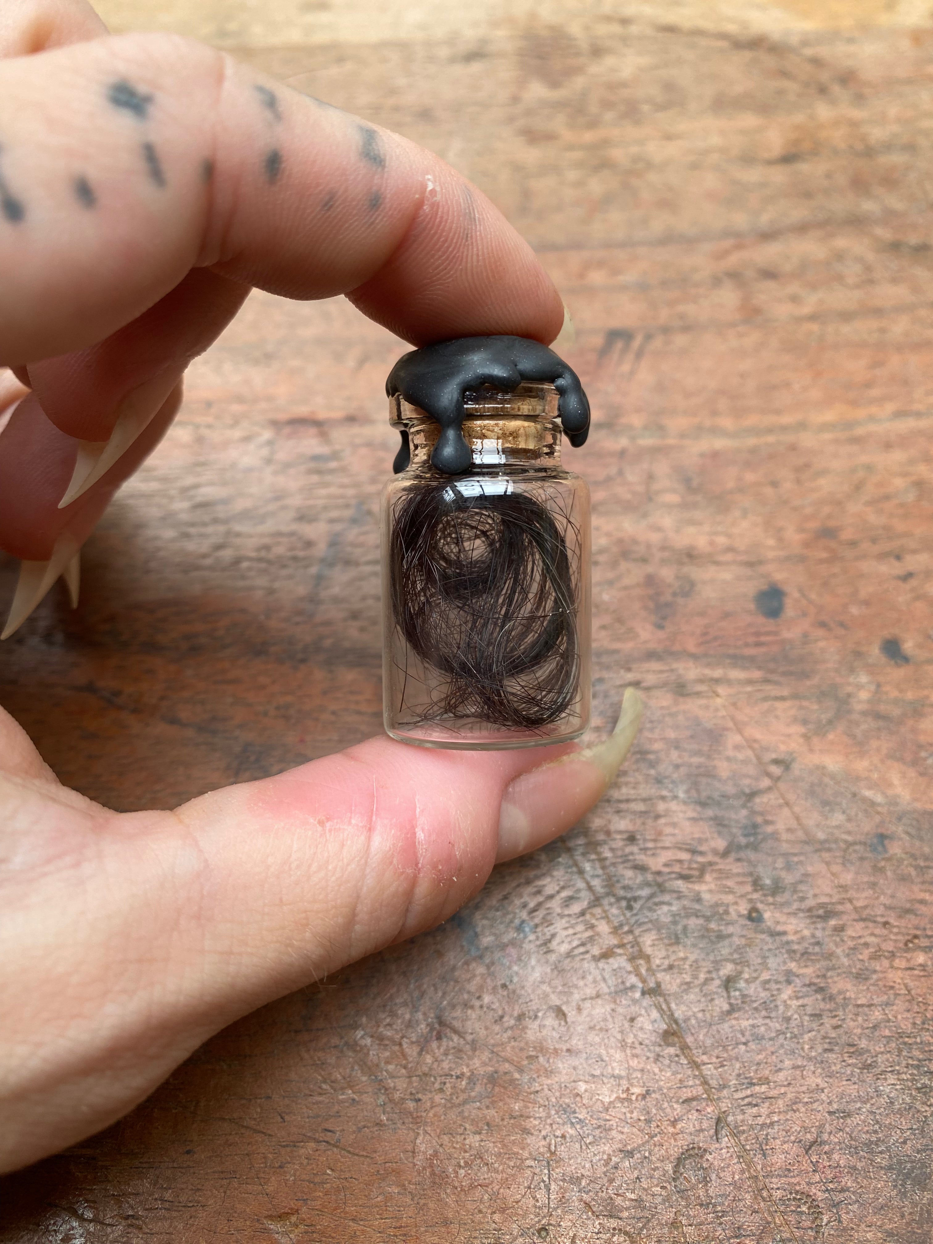 Human Hair in Glass Vial