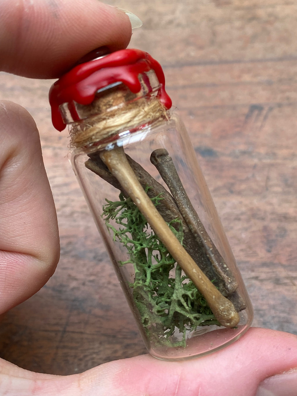 Fossilised Mudlarked Bones in Glass Vial with Eye Spell Jar