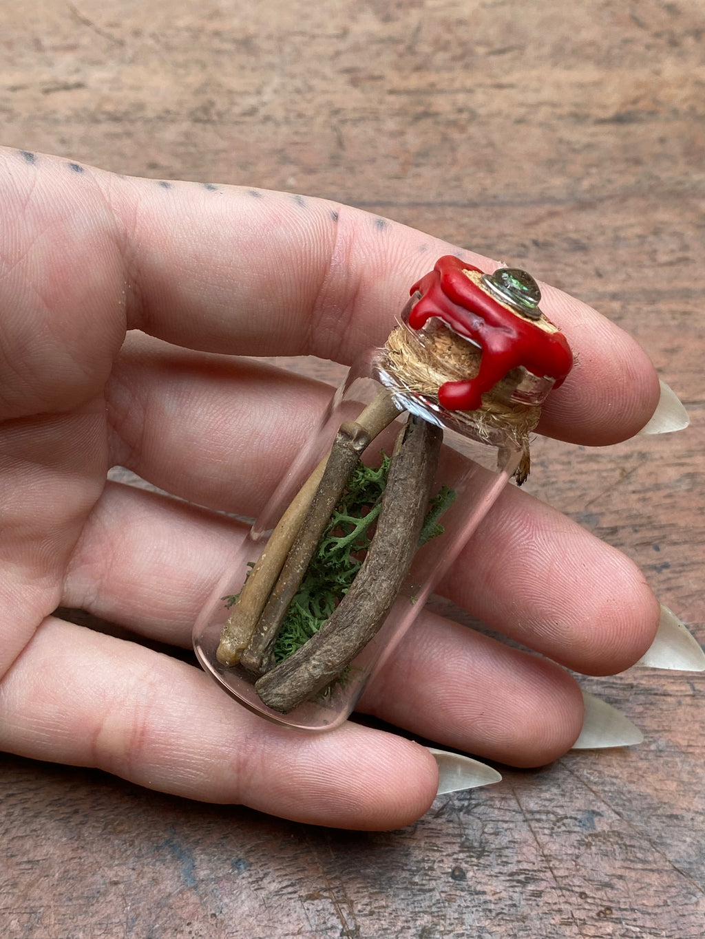 Fossilised Mudlarked Bones in Glass Vial with Eye Spell Jar