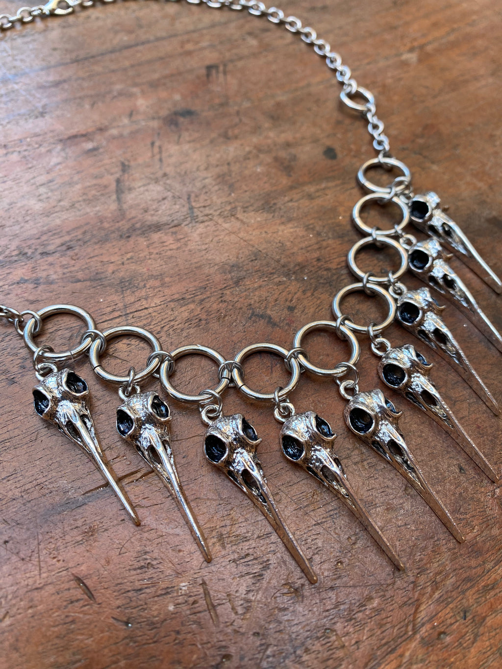 Bird Skull Charms and Steel Rings Necklace