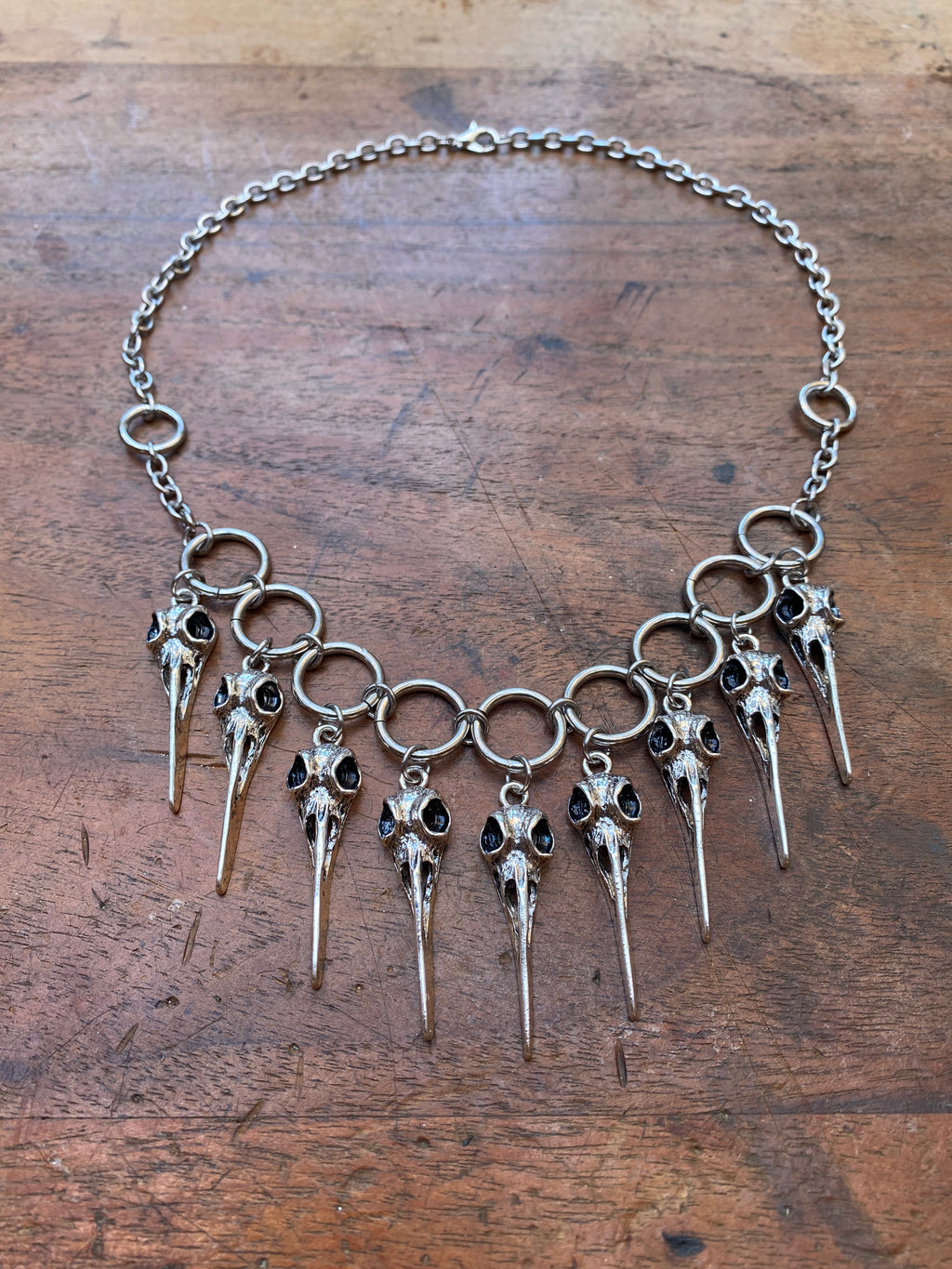 Bird Skull Charms and Steel Rings Necklace