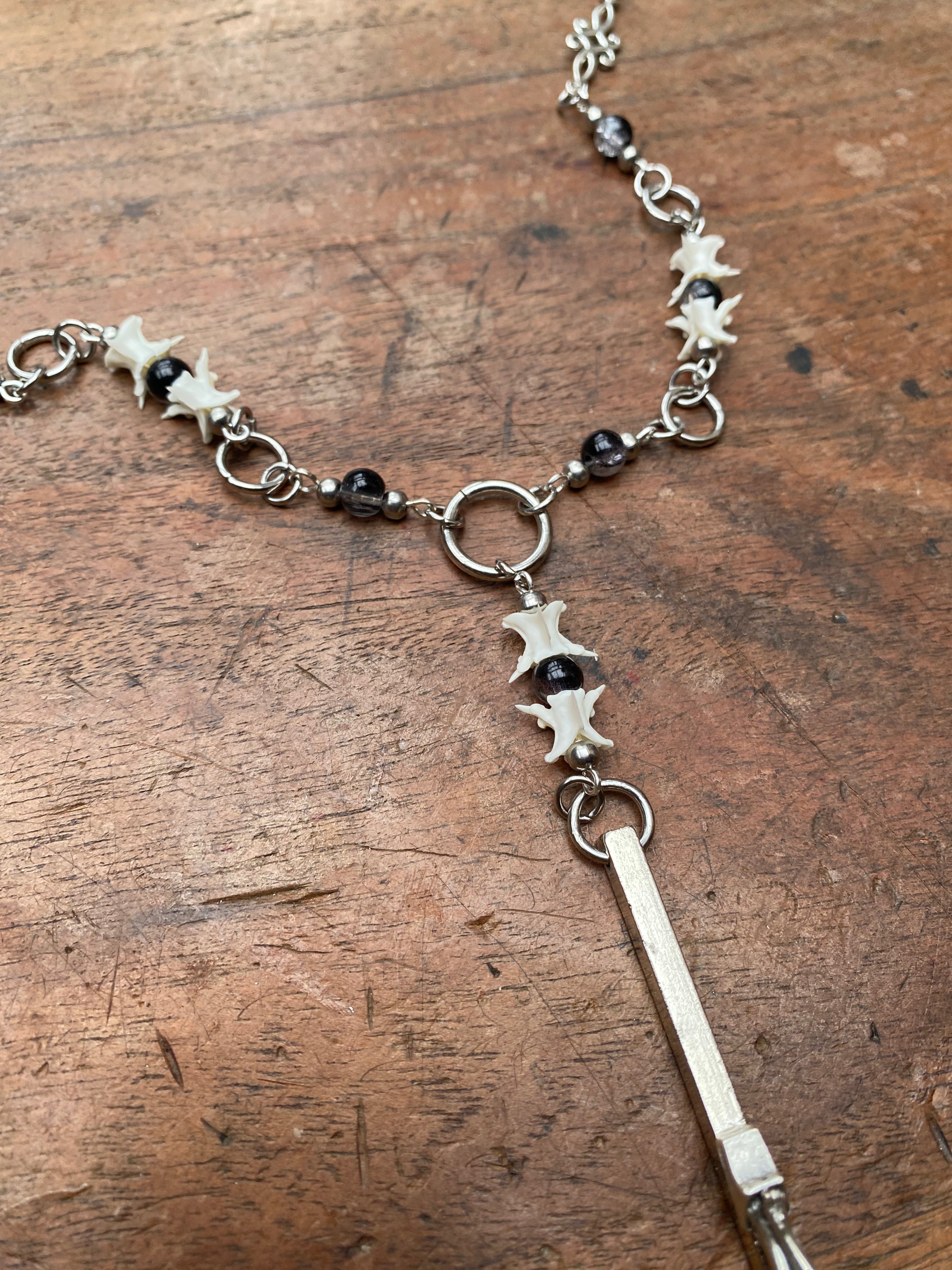 Inverted Crucifix with Snake Vertebrae Rosary Necklace