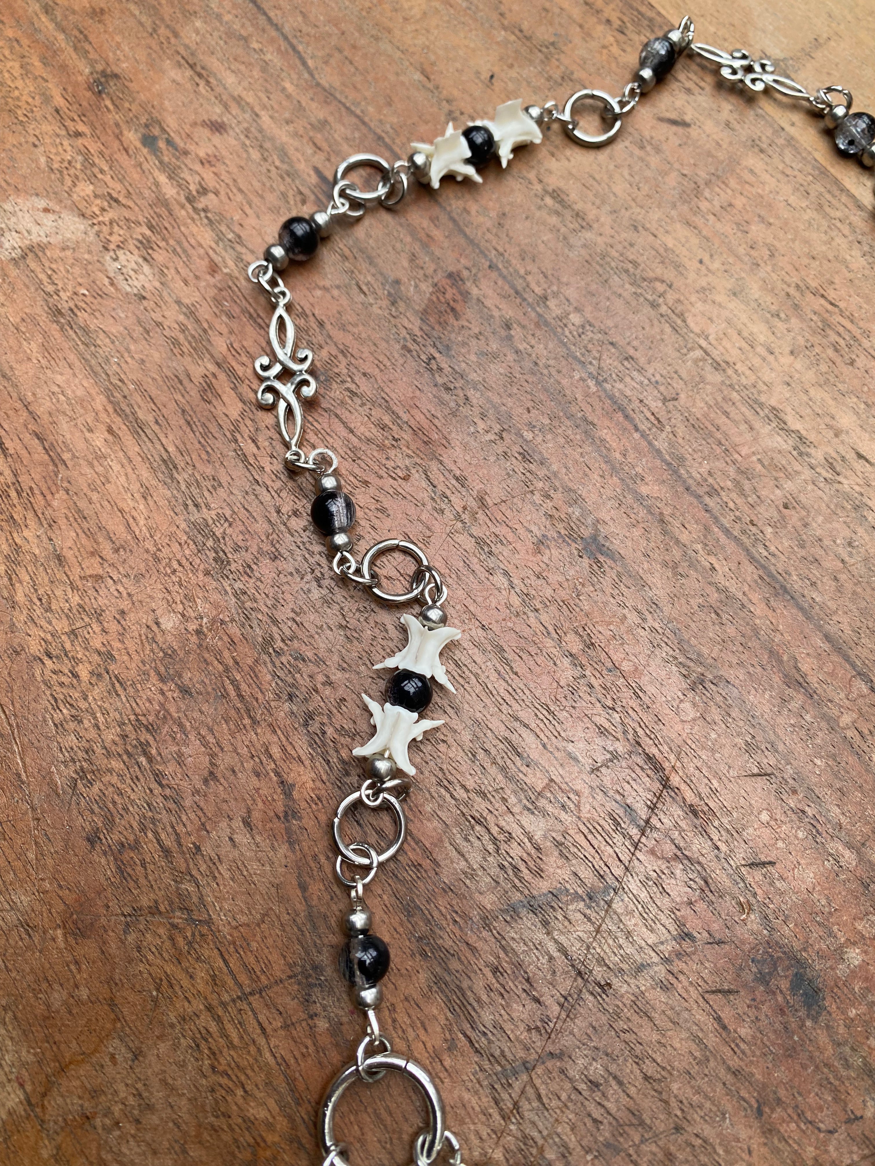 Inverted Crucifix with Snake Vertebrae Rosary Necklace